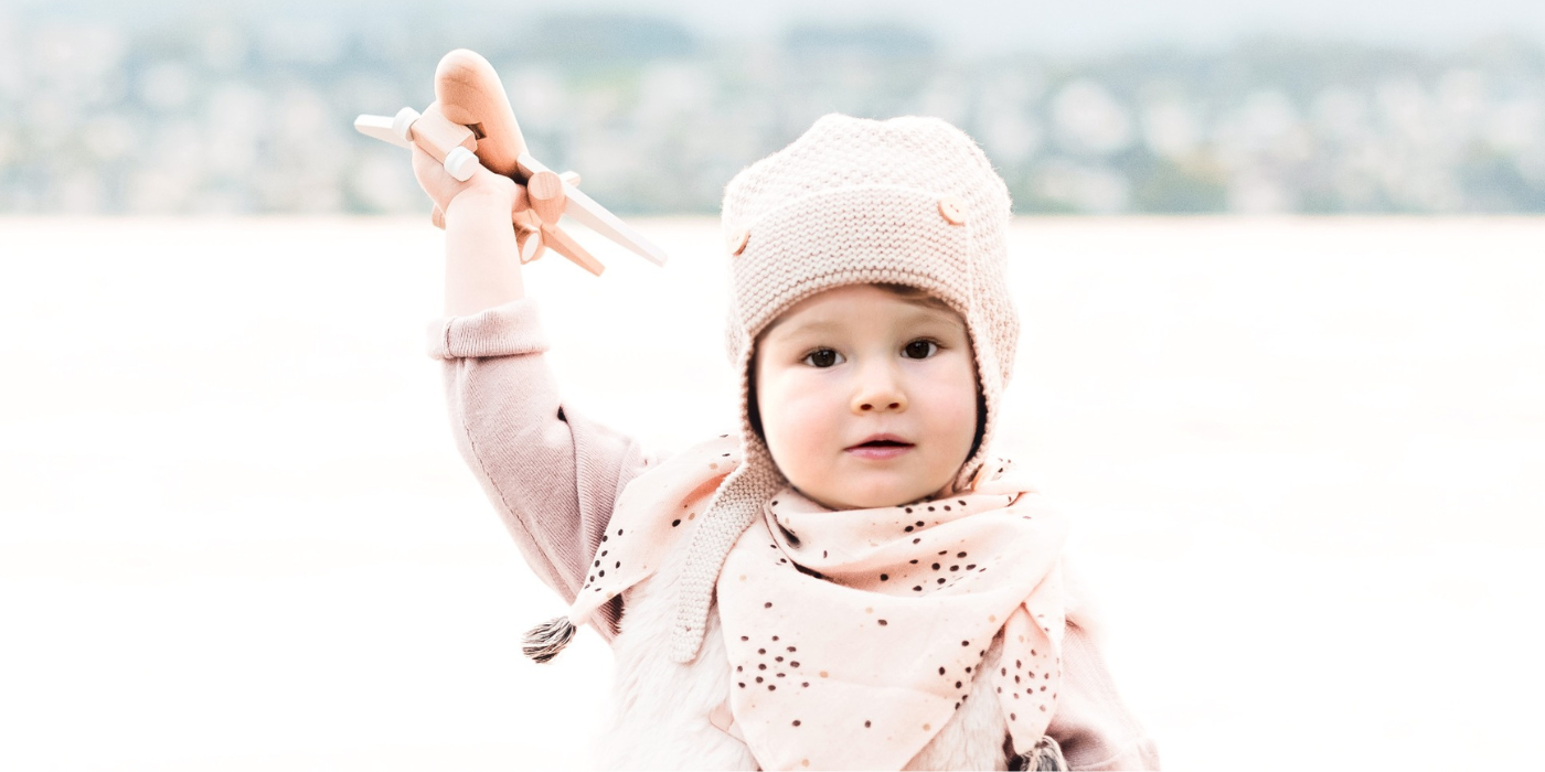 Child-holding-airplane-toy