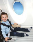 Child wearing CARES Harness on Flyaway Kids Bed